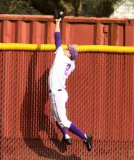Tim Wilson from Linfield brings back a sure fire homerun. (Photo found on Linfield's press release)