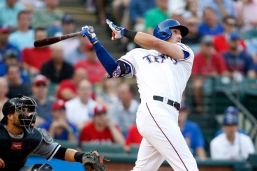 Jun 2, 2015; Arlington, TX, USA; Texas Rangers third baseman Joey Gallo (13) hits a two run home run in the third inning against the Chicago White Sox at Globe Life Park in Arlington. Mandatory Credit: Tim Heitman-USA TODAY Sports ORG XMIT: USATSI-214904 ORIG FILE ID: 20150602_ajw_sh2_098.jpg