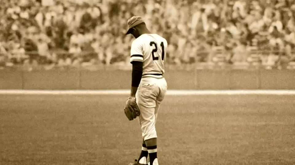 Outfielder Roberto Clemente of the Pittsburgh Pitrates slides back